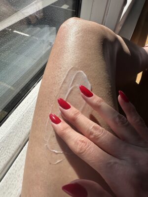 How to Get Smooth Legs by Giving Yourself a Leg Facial applying exfoliating creme to leg