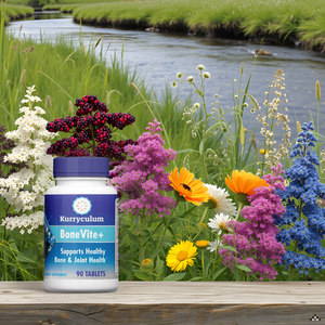 BoneVite+, Bone and Joint Health Supplement, 90 Tablets A close-up view of the product packaging on a wooden surface with a few green leaves scattered aroun