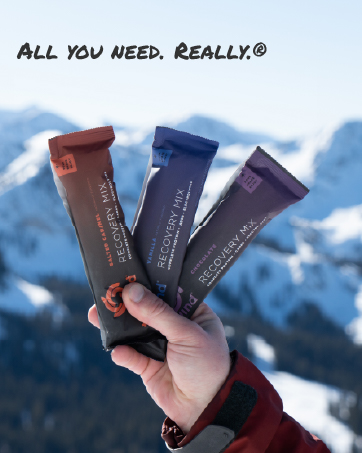 Tailwind Nutrition Endurance Fuel, Carbohydrate & Electrolyte Sports Drink Mix Powder, Gluten-Free, Vegan, Grape, 50 Servings A person holding Recovery Mix hydration-powder packets.Text reads: All you need, all day. Really.
